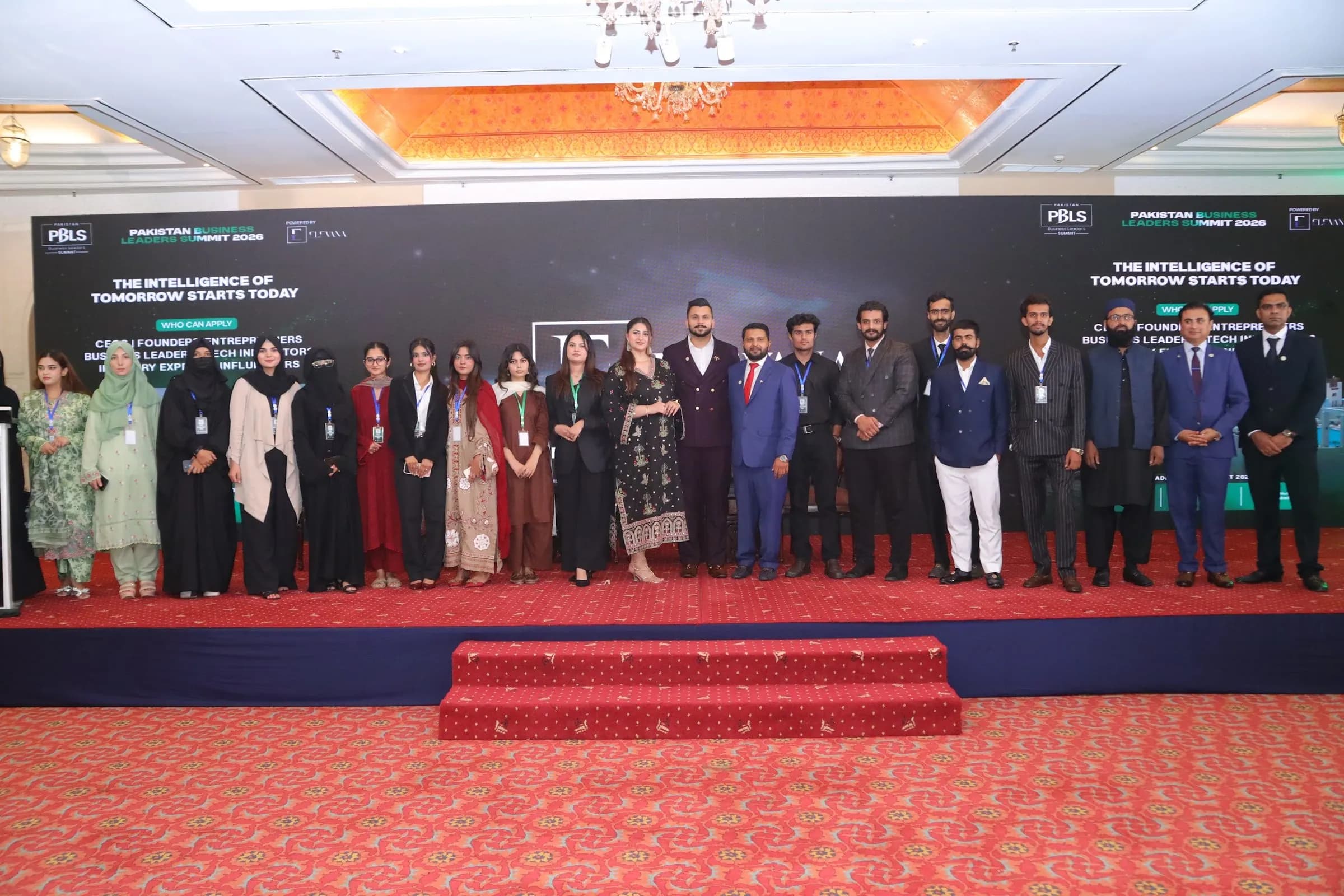 Speakers, partners and the organising team in a group photo on stage at PBLS Serena Islamabad