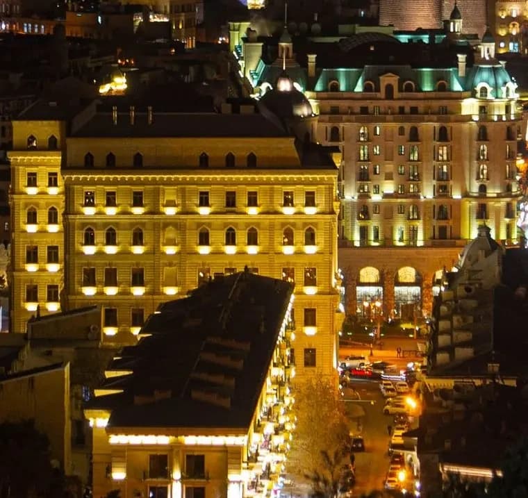 Illuminated historic facades in central Baku at night